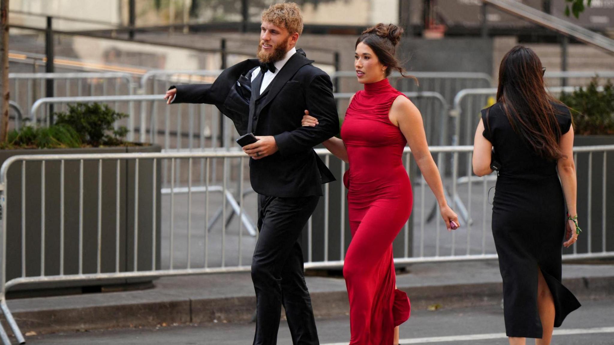 Seattle Seahawks player Cooper Kupp and his wife Anna Marie Kupp walk arm in arm as they arrive at Madison Square Garden.