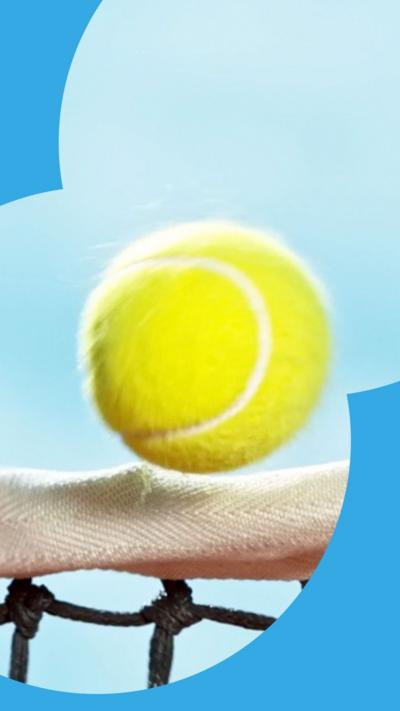 Yellow tennis ball skimming over a net against a blue sky