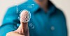 A close-up thumb in front of a digital fingerprint recognition overlay.