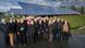 Group photo in the city of Saerbeck with visitors from the US in front of a solar panel park Group photo in the city of Saerbeck with visitors from the US in front of a solar panel park