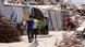 Displaced Palestinian families continue their daily lives in temporary tents Displaced Palestinian families continue their daily lives in temporary tents
