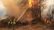 Firefighters battle a fire surrounding La Atalaya residential area in El Tiemblo, west of Madrid (July 25, 2026) Firefighters battle a fire surrounding La Atalaya residential area in El Tiemblo, west of Madrid (July 25, 2026)