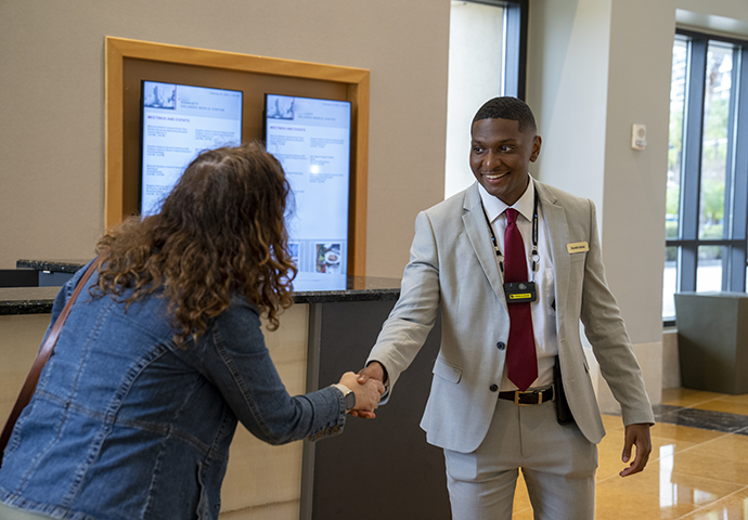 Hotel worker talking with guest