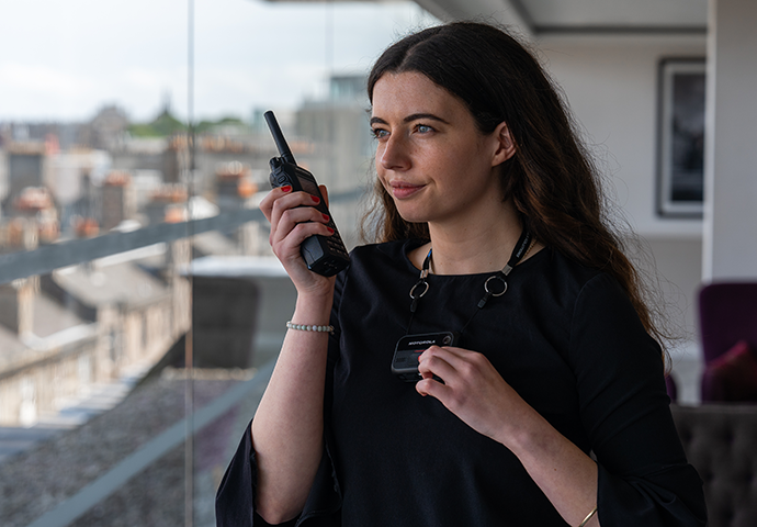 Hotel worker talking in to radio